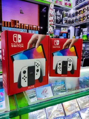 Nintendo Switch OLED blanche en excellent état avec boîte d'origine - Miniature 4