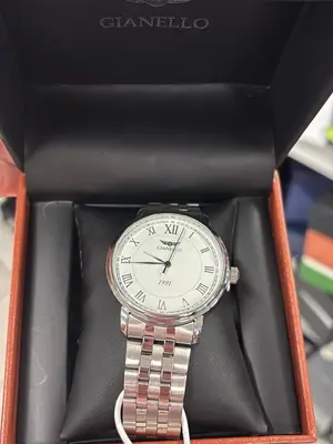 Montre Gianello 1991 argentée, cadran blanc à chiffres romains et bracelet acier