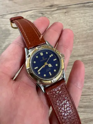 Montre Festina quartz bicolore acier doré cadran bleu nuit bracelet cuir
