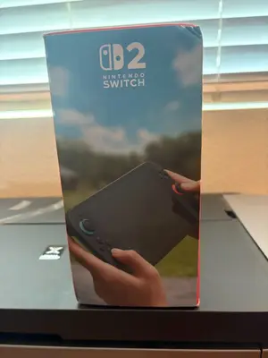 Nintendo Switch 2 couleurs noir en parfait état