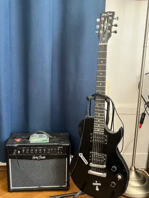 Guitare électrique Harley Benton avec ampli, défaut sur la tête