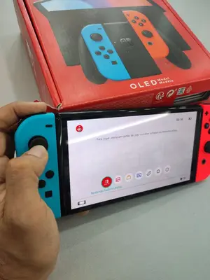 Nintendo Switch OLED blanche en bon état avec Joy-Con, dock et boîte - Miniature 2