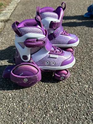 Rollers réglables HUDORA violets pour enfant, taille 26–29, bon état
