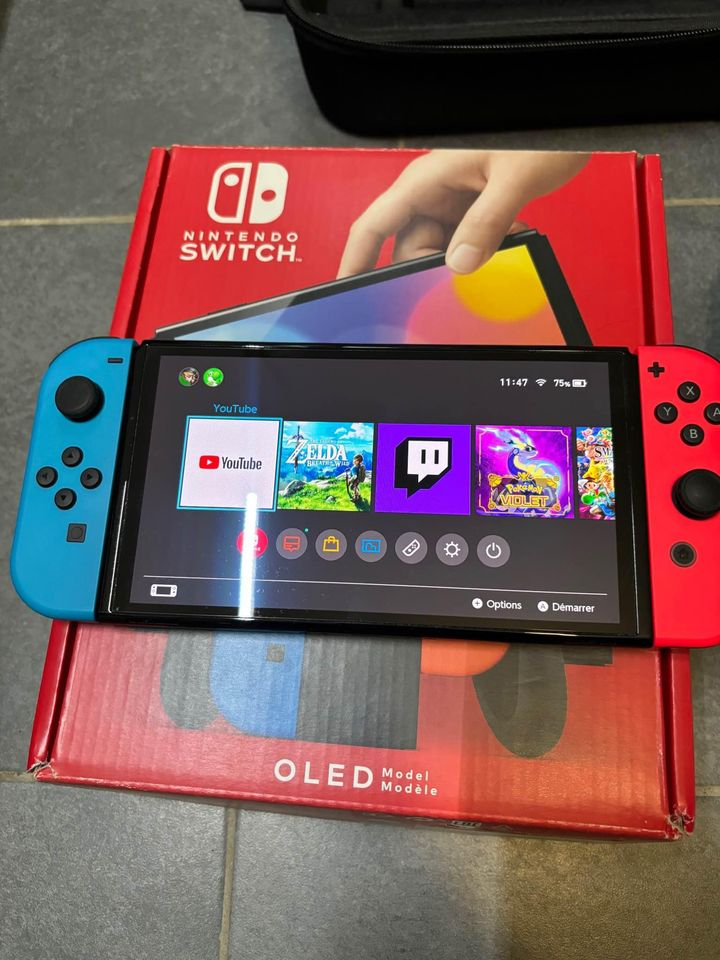 Nintendo Switch Oled + 2 jeux + manette pro + housse transport