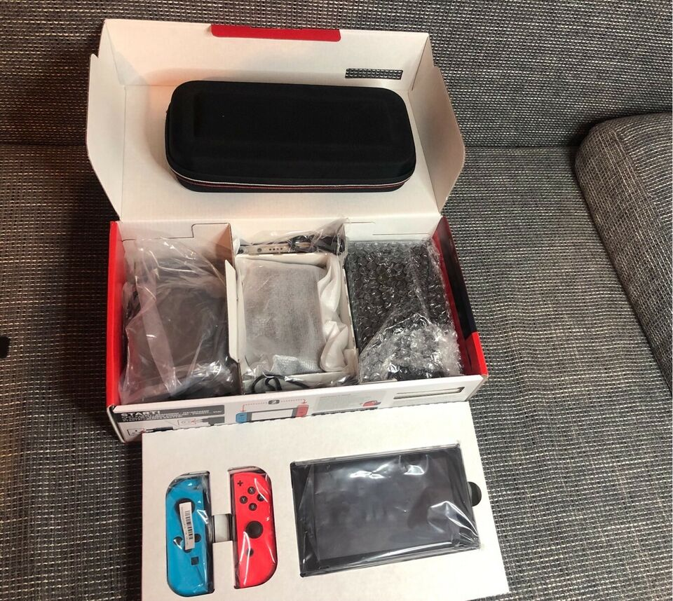 Nintendo Switch V2 avec 2 jeux et accessoires d'occasion - PS
